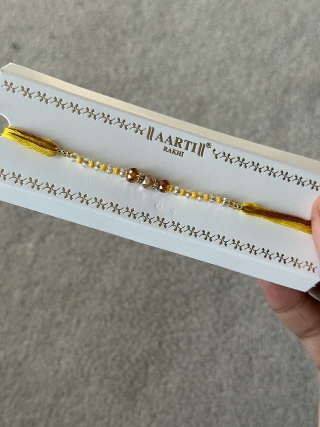 Yellow traditional Rakhi