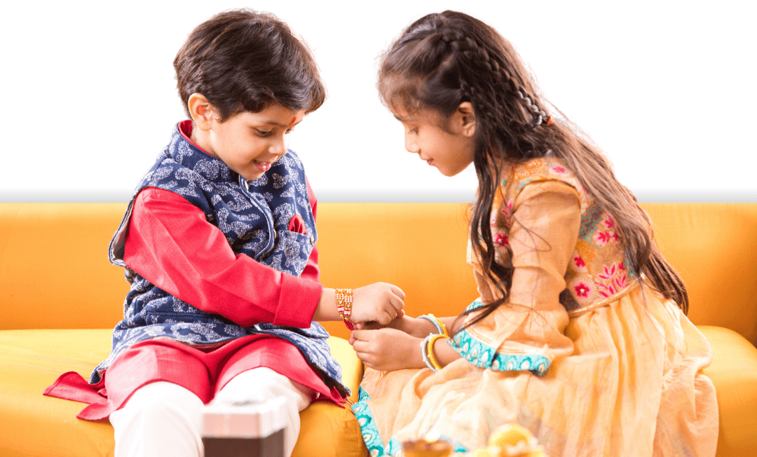 Sister tying rakhi to her brother's wrist during Raksha Bandhan celebration